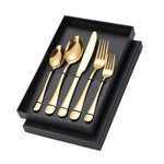 Elegant stainless steel cutlery set displayed in a sleek black gift box, including spoons, forks, and knives for dining.